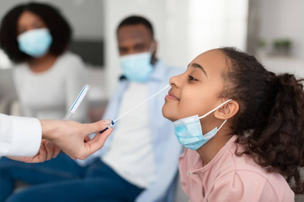 Doctor taking PCR test sample from potentially infected black woman